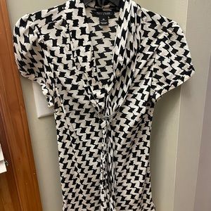 A lightweight short sleeved blouse 29” long